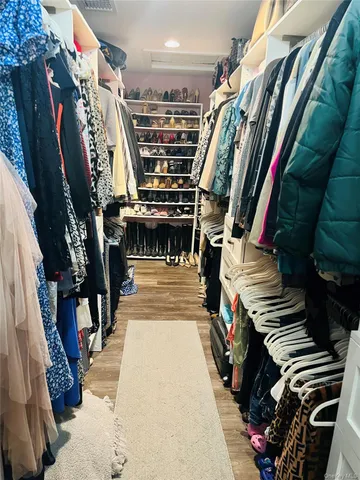 a bed room with a bed and a television