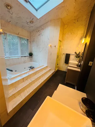 a bed room with a bed and a television