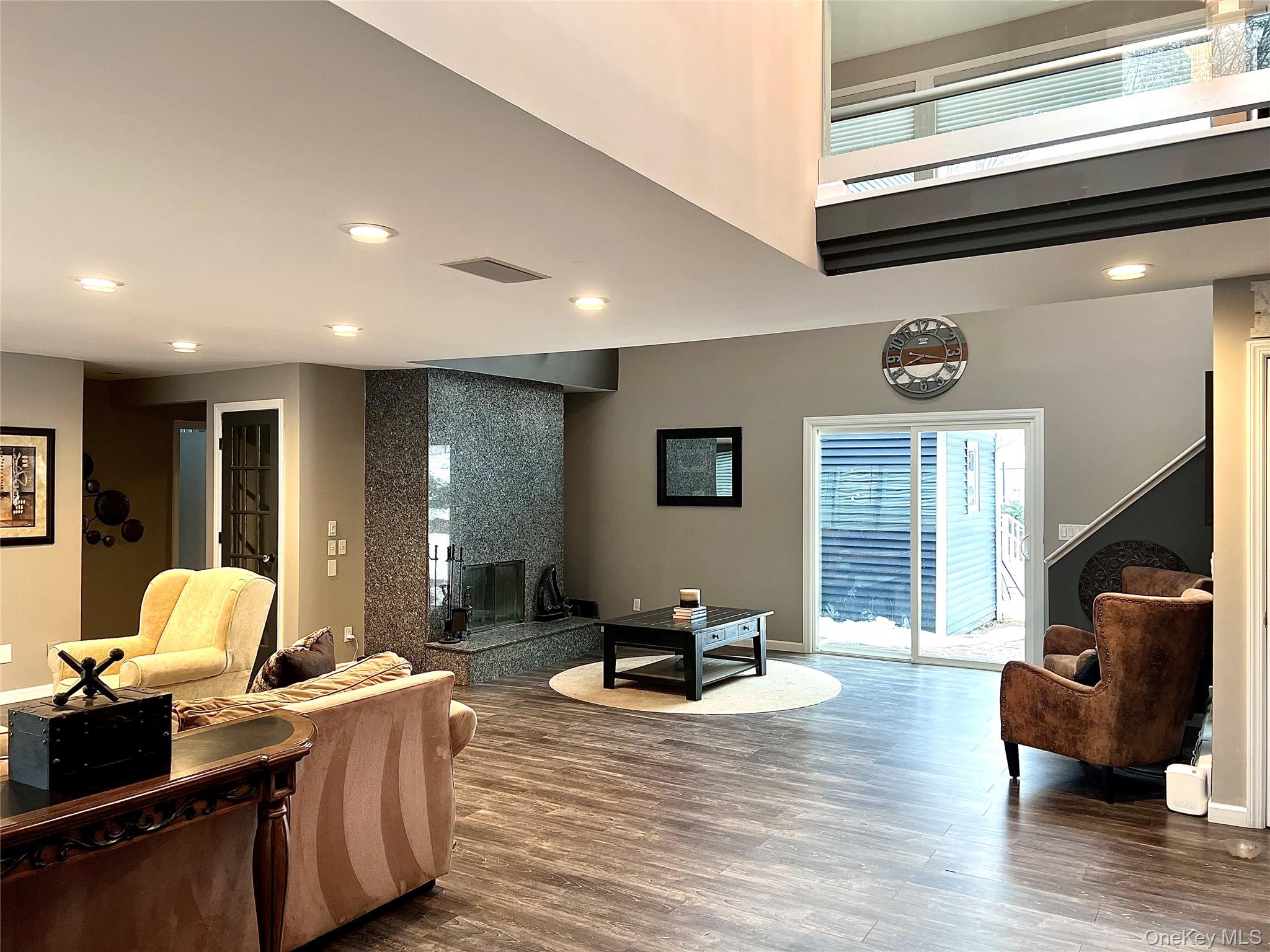 30 Lone Oak Path Smithtown, NY 11787 - Photo 10 of 39 a living room with furniture window and wooden floor