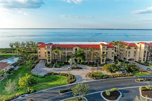 a view of a chairs and table in a backyard