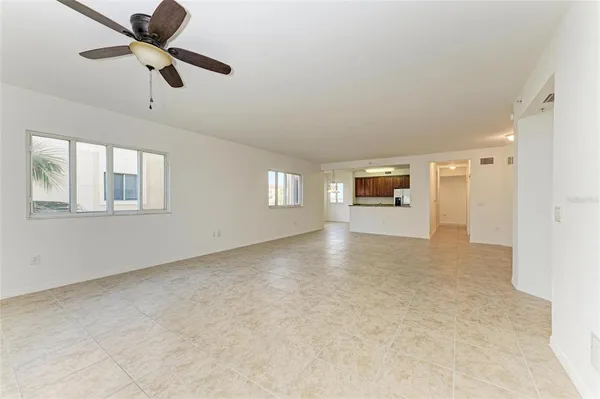 a kitchen with stainless steel appliances granite countertop a sink refrigerator and cabinets