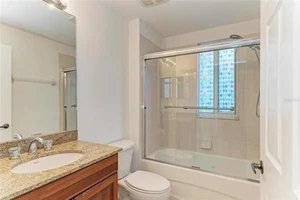 a front view of a building with a yard