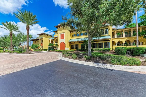 a view of a swimming pool with sitting area