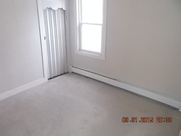 77 Langley Street Fall River, MA 02720 - Photo 5 of 10 an empty room with windows