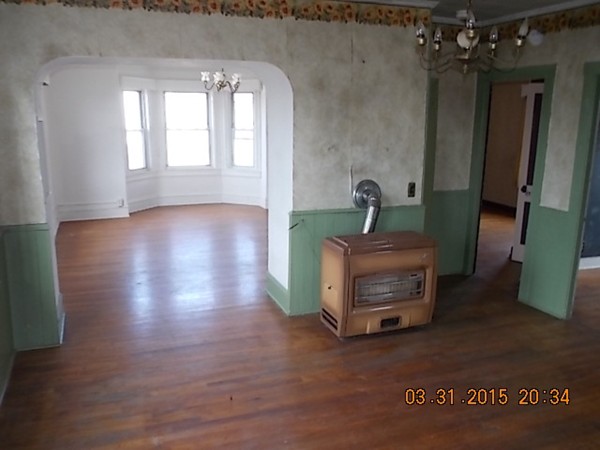 77 Langley Street Fall River, MA 02720 - Photo 7 of 10 a living room with furniture and a mirror