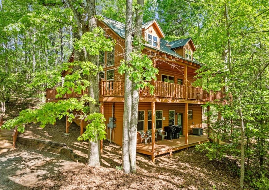 front view of a house with a tree