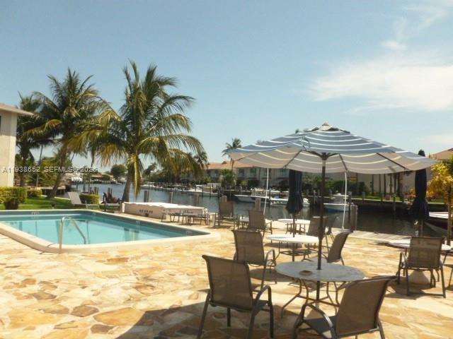 a view of a swimming pool with a patio
