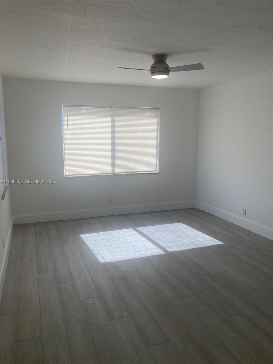 199 East McNab Road, Unit 101 Pompano Beach, FL 33060 - Photo 11 of 15 an empty room with a window