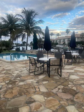 a view of a patio with swimming pool