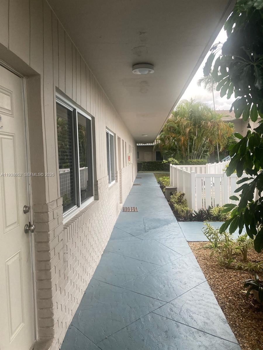 199 East McNab Road, Unit 101 Pompano Beach, FL 33060 - Photo 14 of 15 a view of a house with a backyard