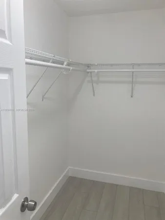 a view of a room with racks on the wall