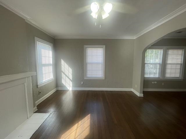 754 McConnell Street Memphis, TN 38112 - Photo 2 of 16 an empty room with wooden floor and windows