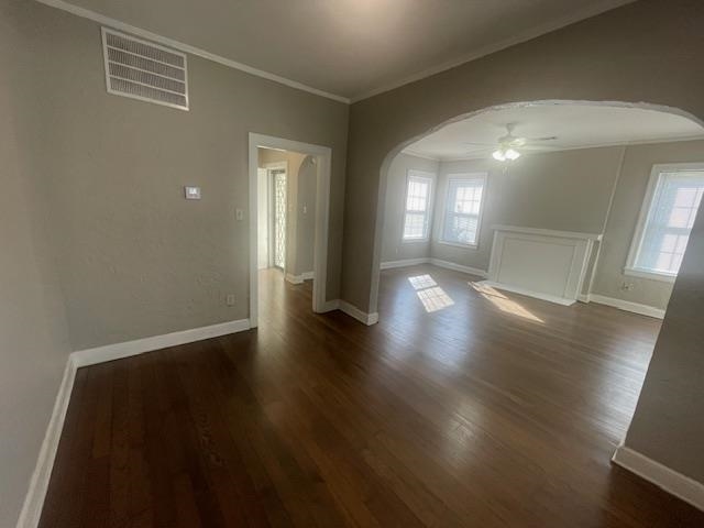 754 McConnell Street Memphis, TN 38112 - Photo 4 of 16 an empty room with wooden floor and windows