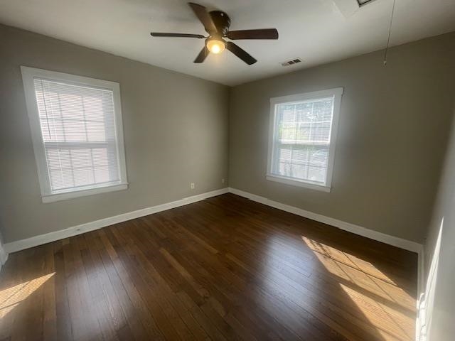 754 McConnell Street Memphis, TN 38112 - Photo 9 of 16 a view of an empty room with wooden floor and a window