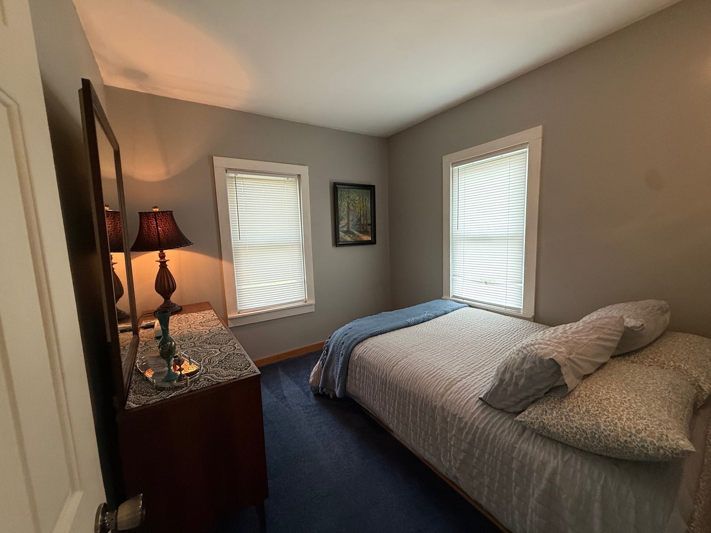 707 Monroe Street Oregon, IL 61061 - Photo 4 of 8 a bedroom with a bed and wooden floor