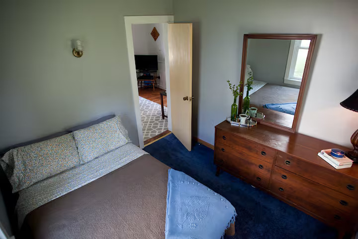 707 Monroe Street Oregon, IL 61061 - Photo 5 of 8 a living room with furniture and a mirror