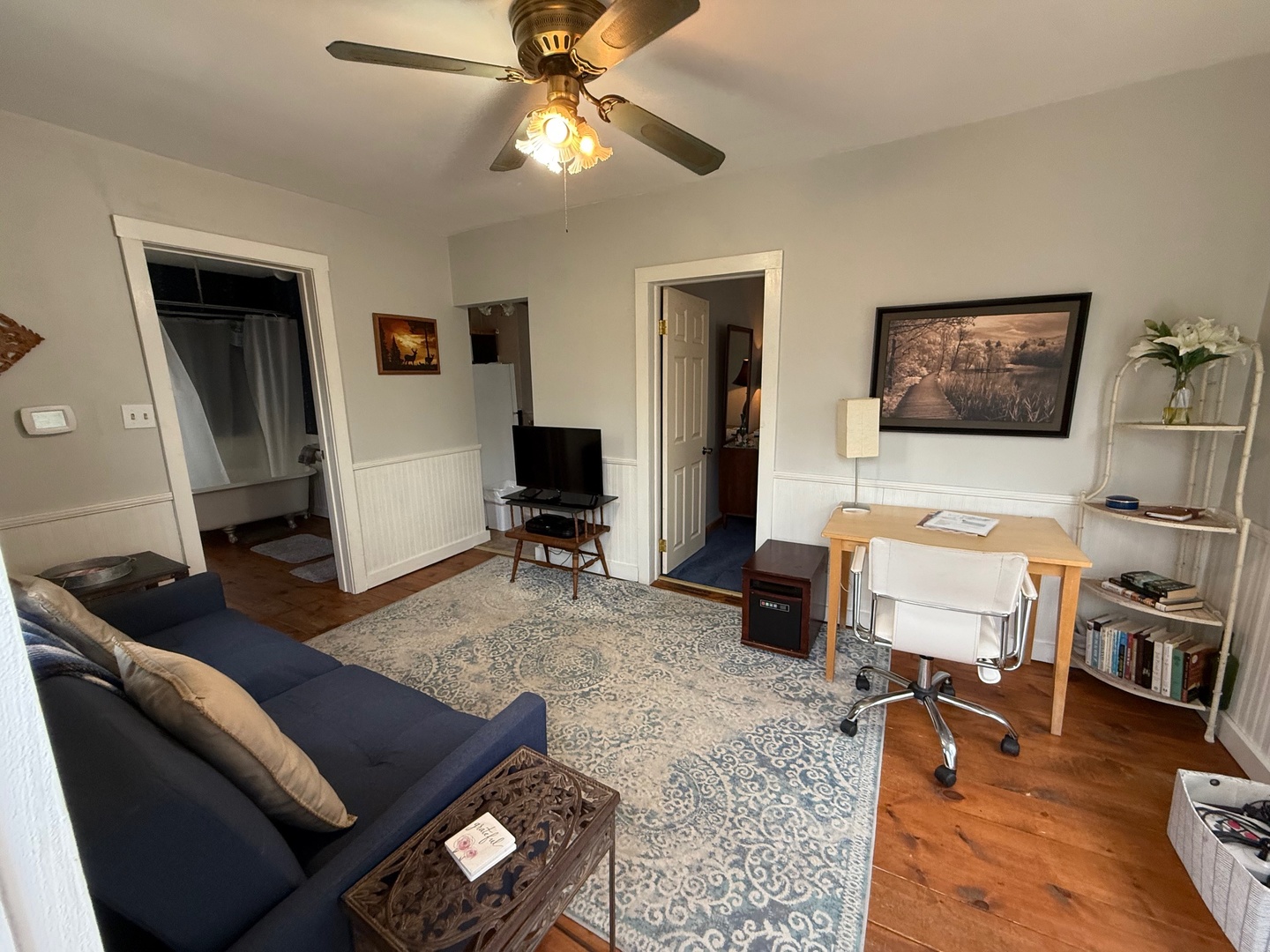 707 Monroe Street Oregon, IL 61061 - Photo 6 of 8 a living room with furniture and a flat screen tv