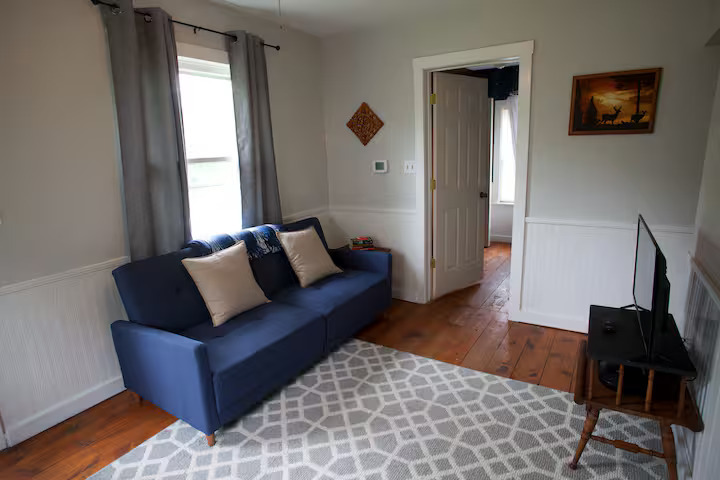 707 Monroe Street Oregon, IL 61061 - Photo 7 of 8 a living room with furniture and a window