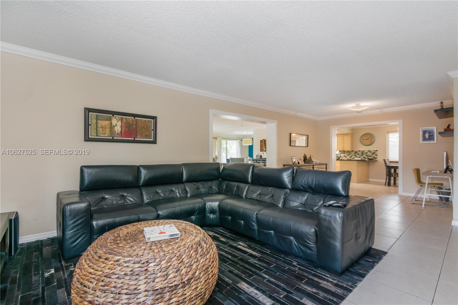 3339 West Park Road Hollywood, FL 33021 - Photo 11 of 28 a living room with furniture and a rug