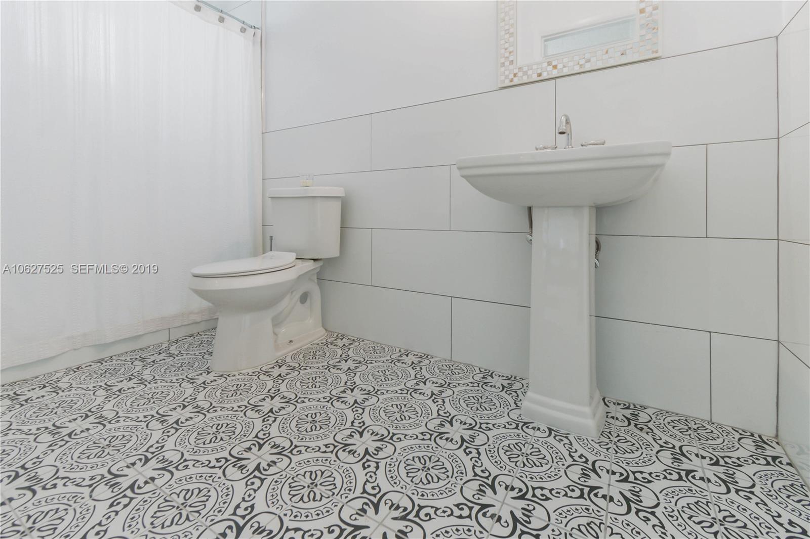 3339 West Park Road Hollywood, FL 33021 - Photo 15 of 28 a bathroom with a sink toilet