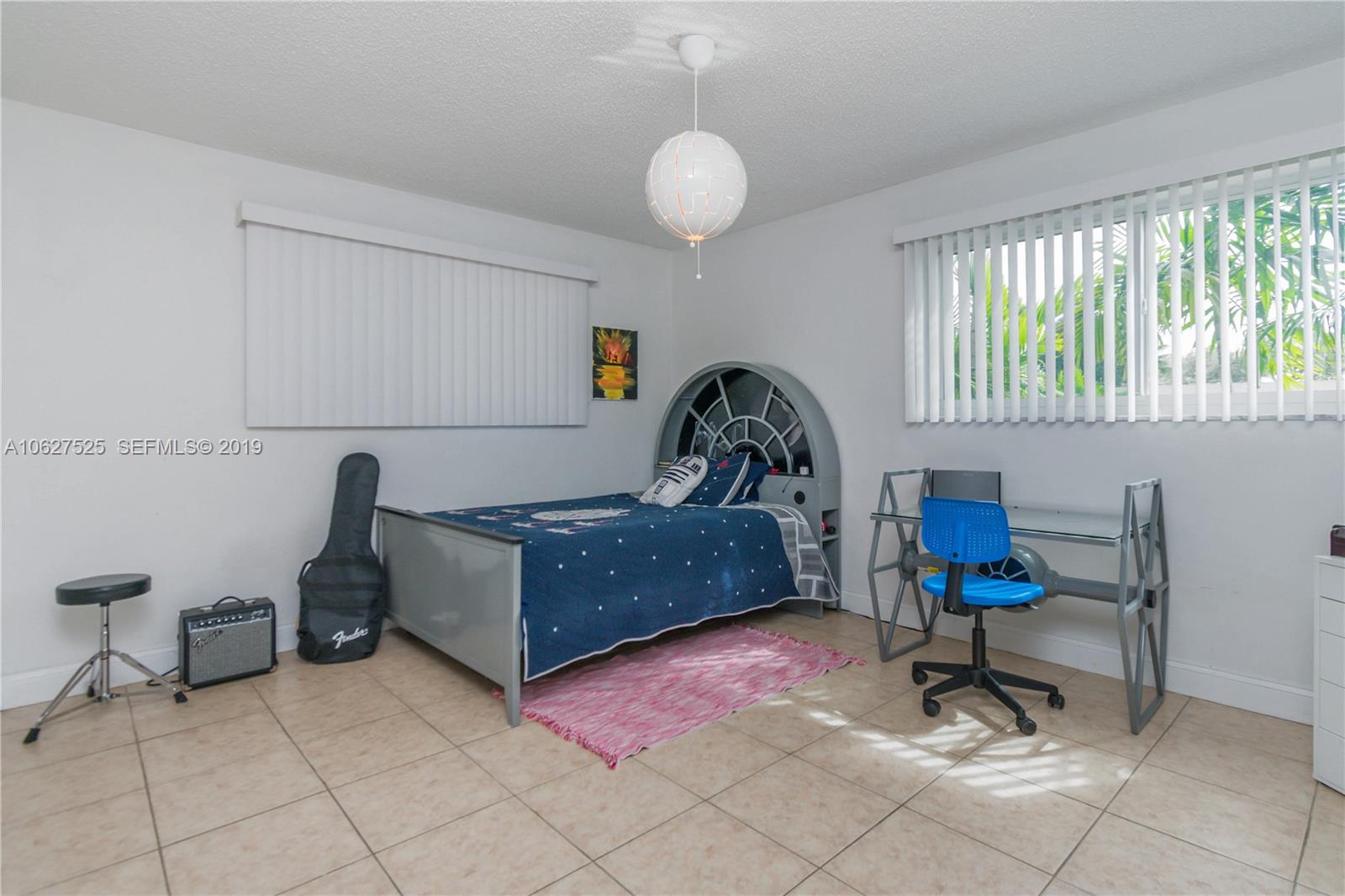 3339 West Park Road Hollywood, FL 33021 - Photo 19 of 28 a living room with furniture and a large window
