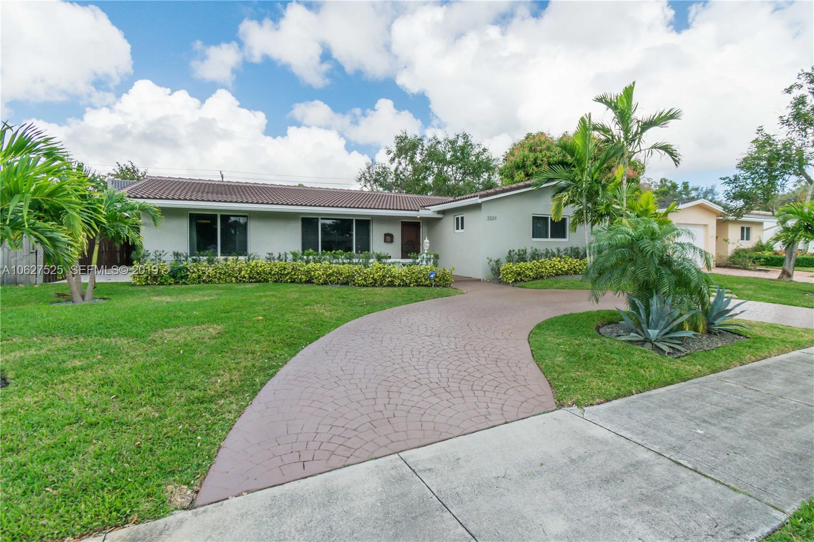 3339 West Park Road Hollywood, FL 33021 - Photo 2 of 28 a view of a house with a yard