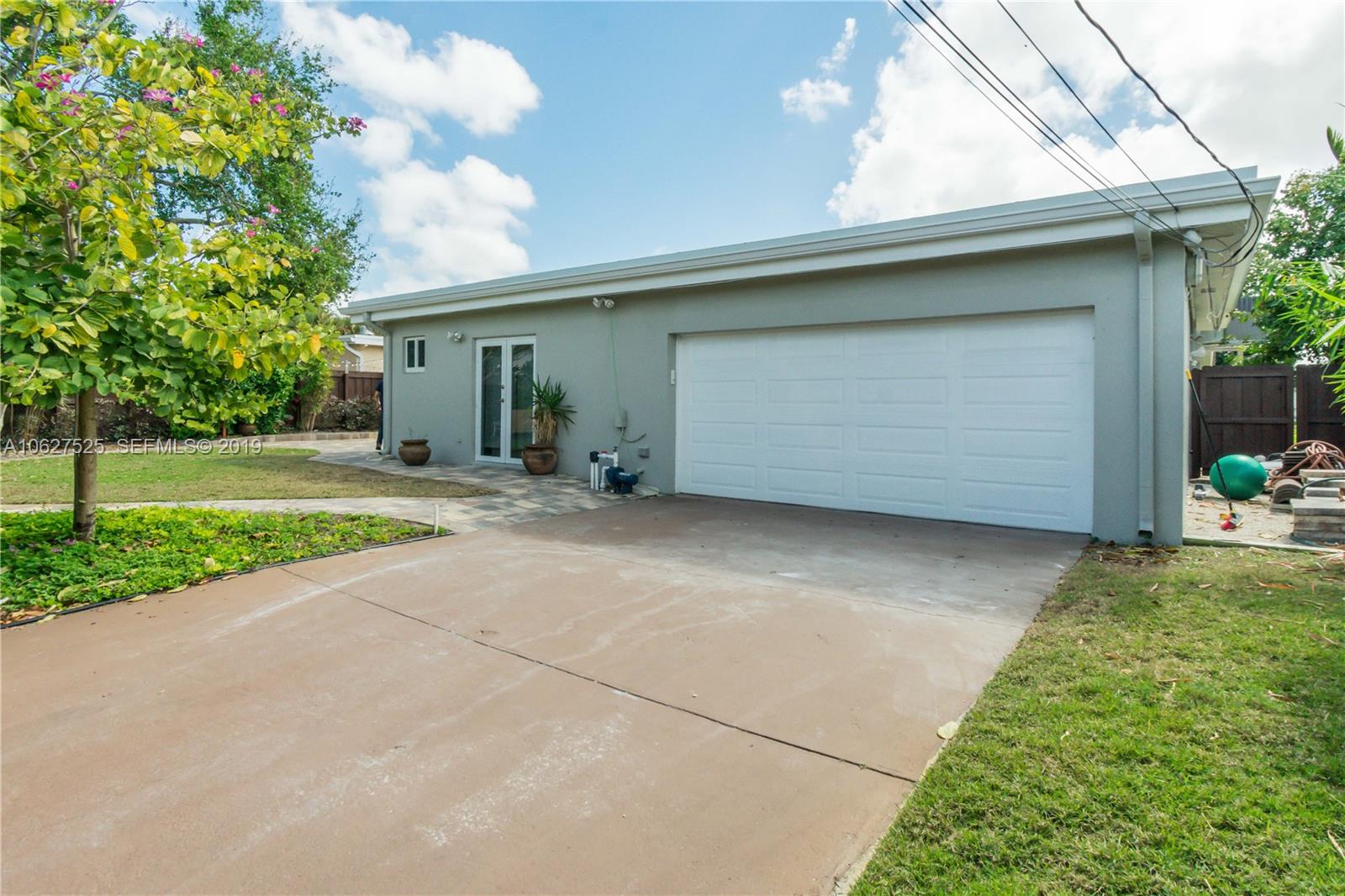 3339 West Park Road Hollywood, FL 33021 - Photo 21 of 28 a view of a house with a yard and garage