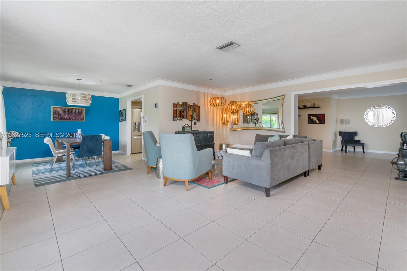 3339 West Park Road Hollywood, FL 33021 - Photo 5 of 28 a living room with furniture and a dining table with kitchen view