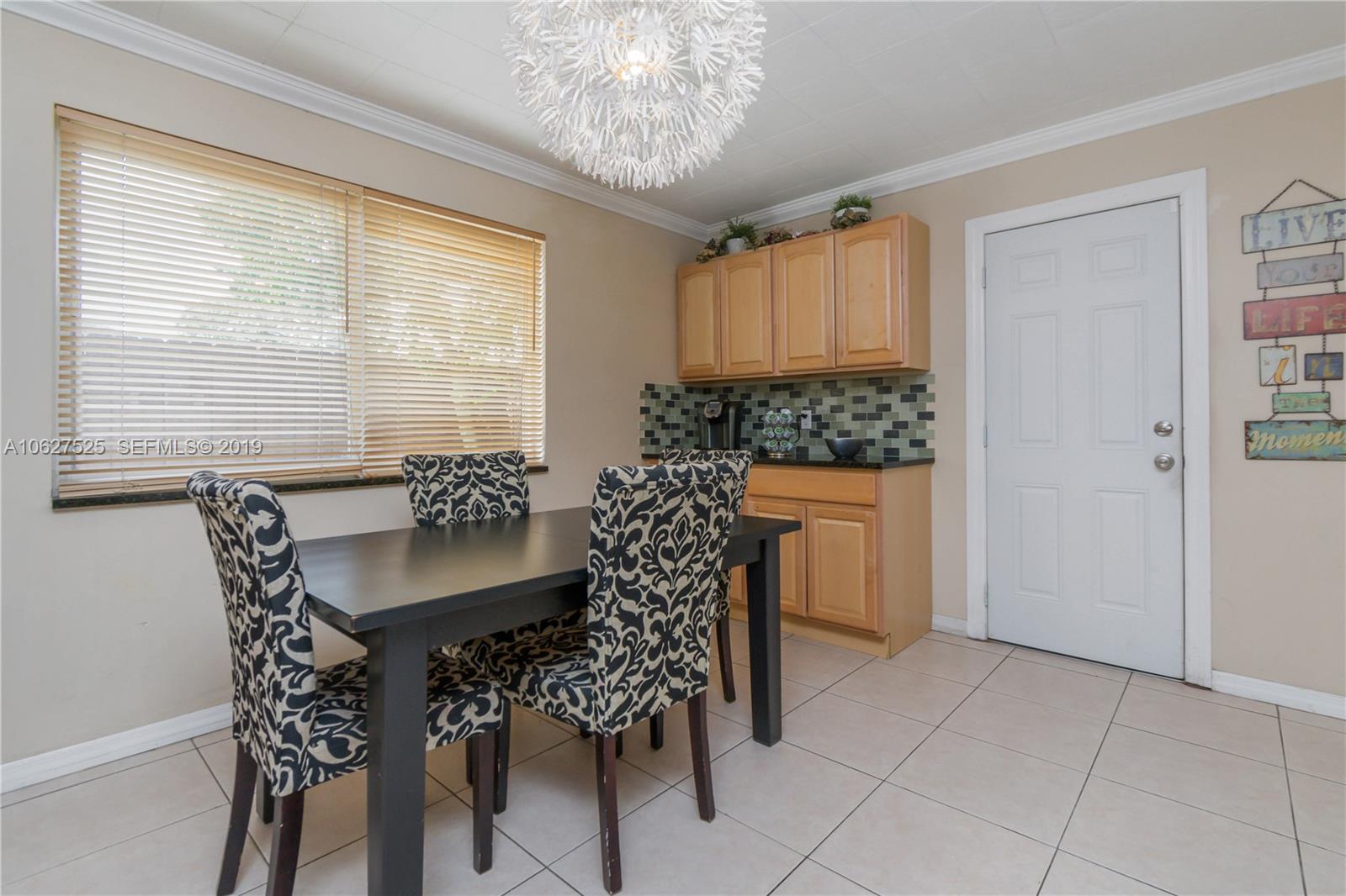 3339 West Park Road Hollywood, FL 33021 - Photo 10 of 28 a dining room with furniture and window