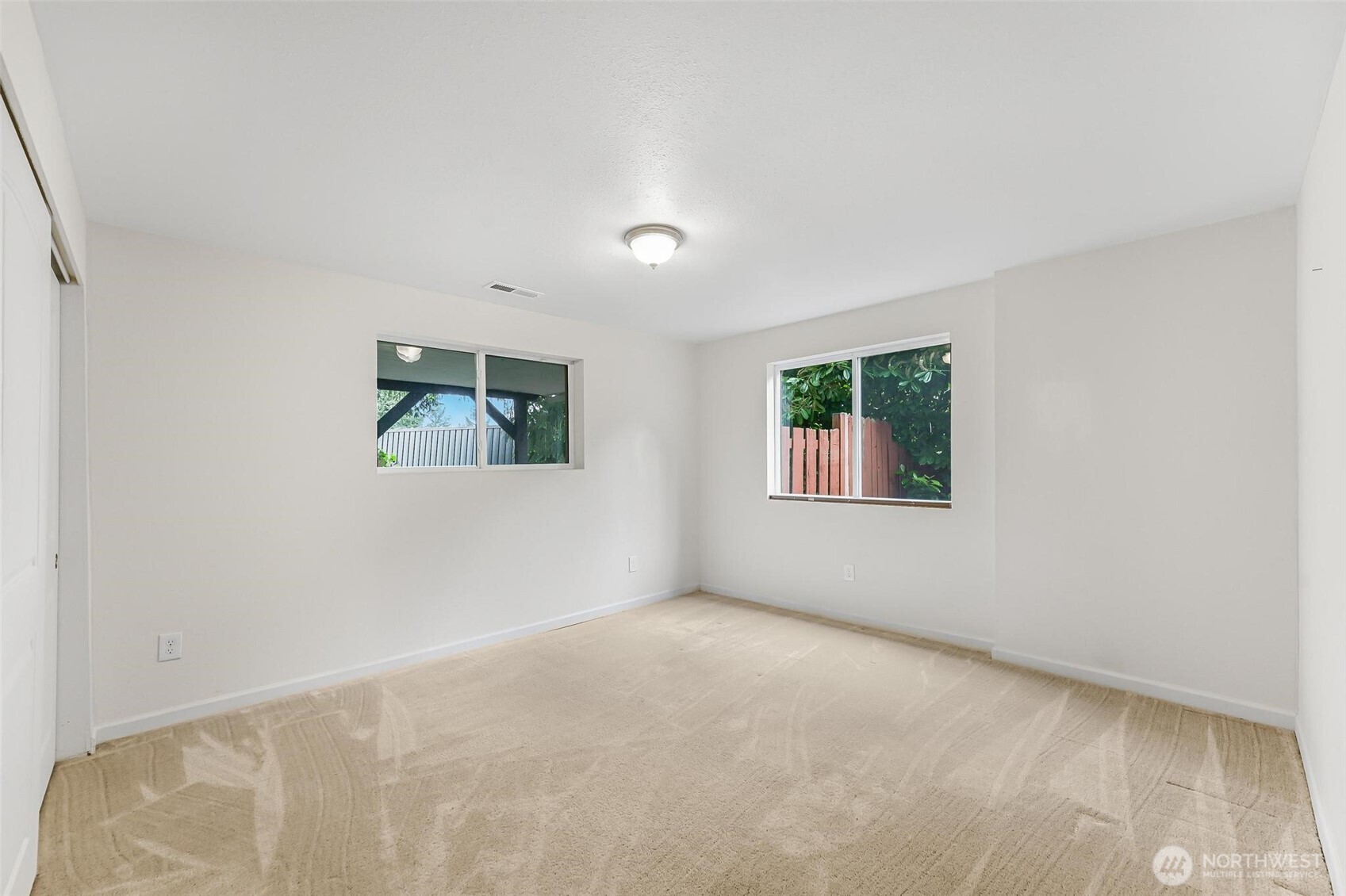 11404 Karshner Road East Edgewood, WA 98372 - Photo 31 of 40 an empty room with windows