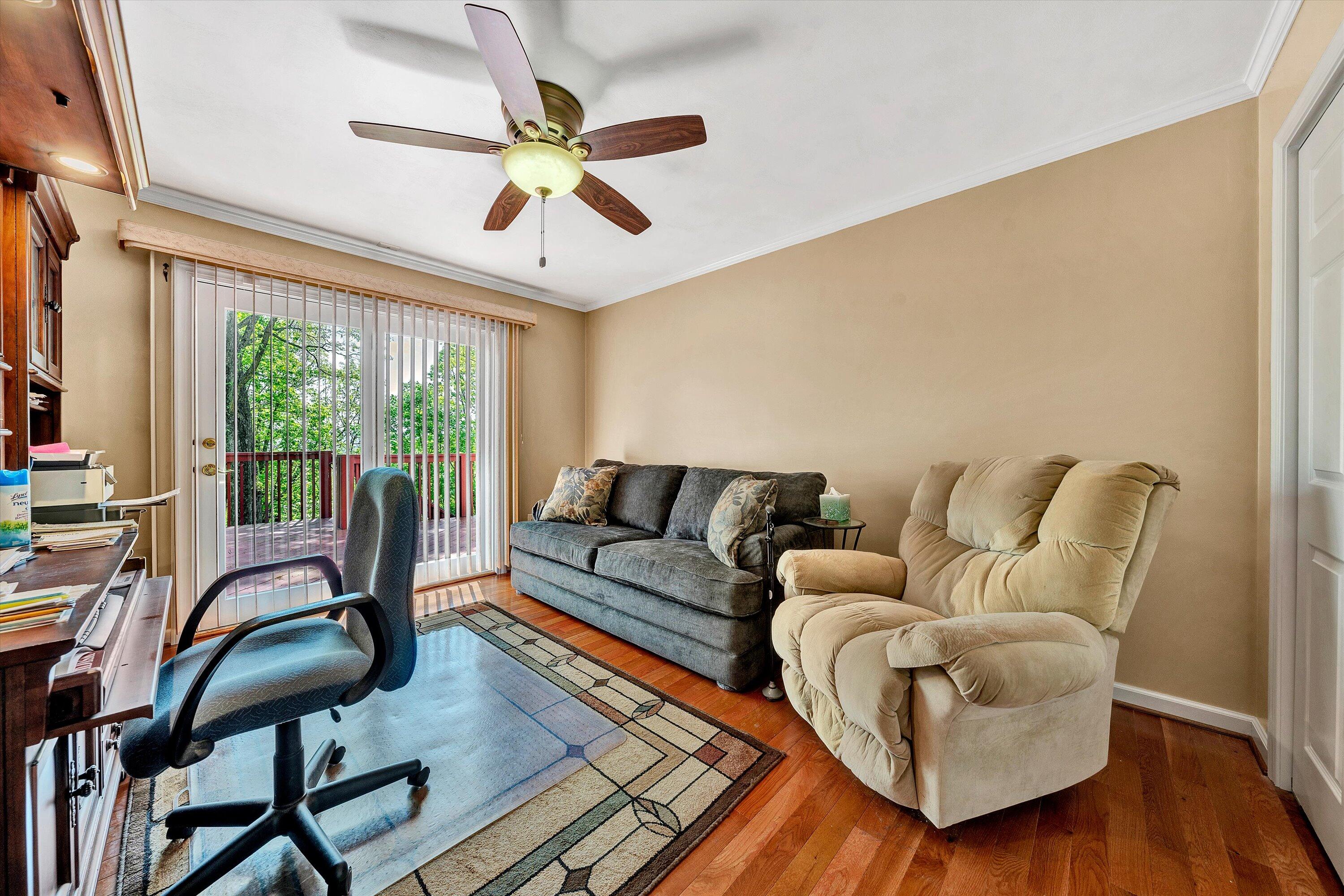 2921 Lockridge Road Southwest Roanoke, VA 24014 - Photo 23 of 53 a living room with furniture ceiling fan and a window