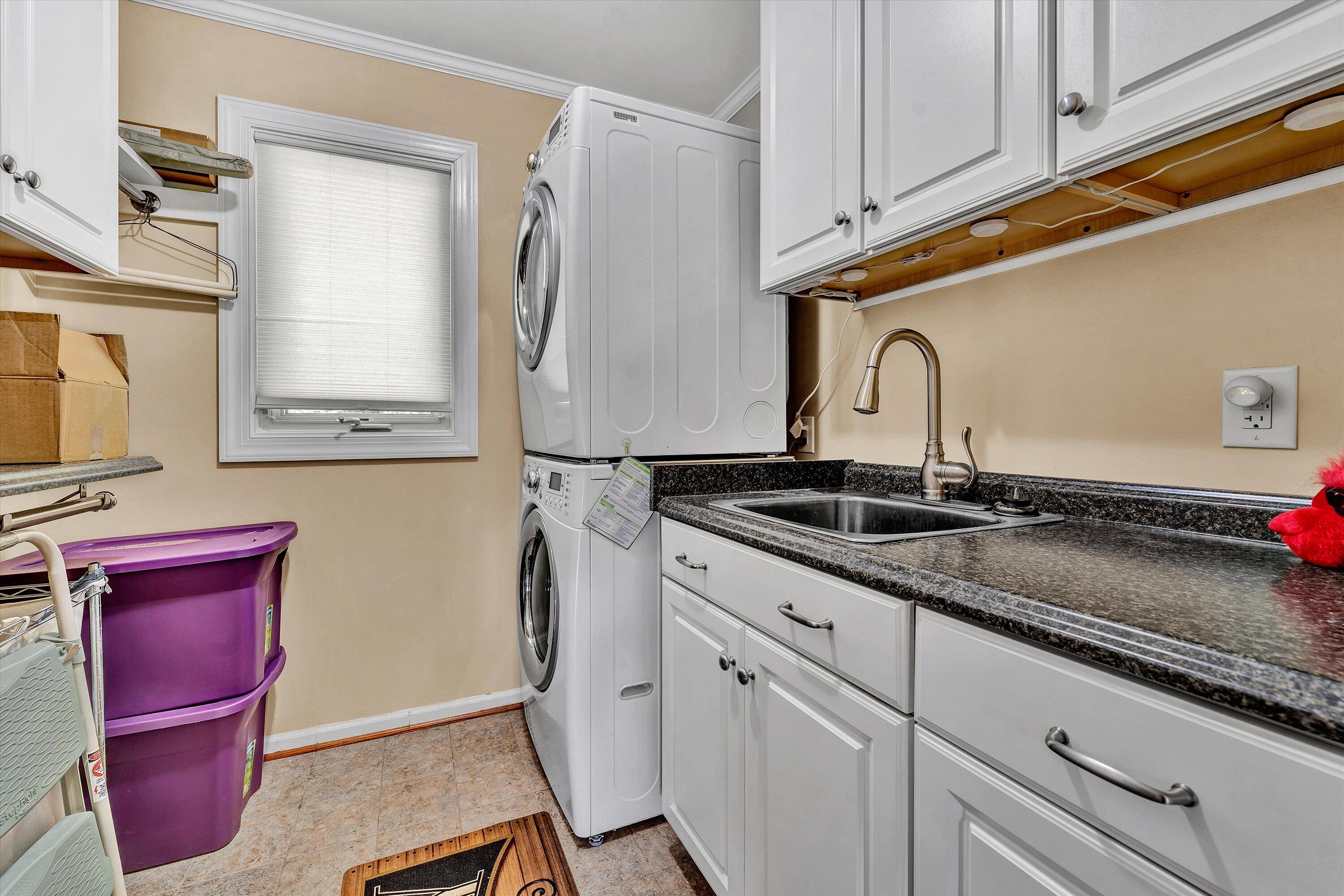 2921 Lockridge Road Southwest Roanoke, VA 24014 - Photo 25 of 53 a kitchen with stainless steel appliances granite countertop a sink refrigerator and microwave