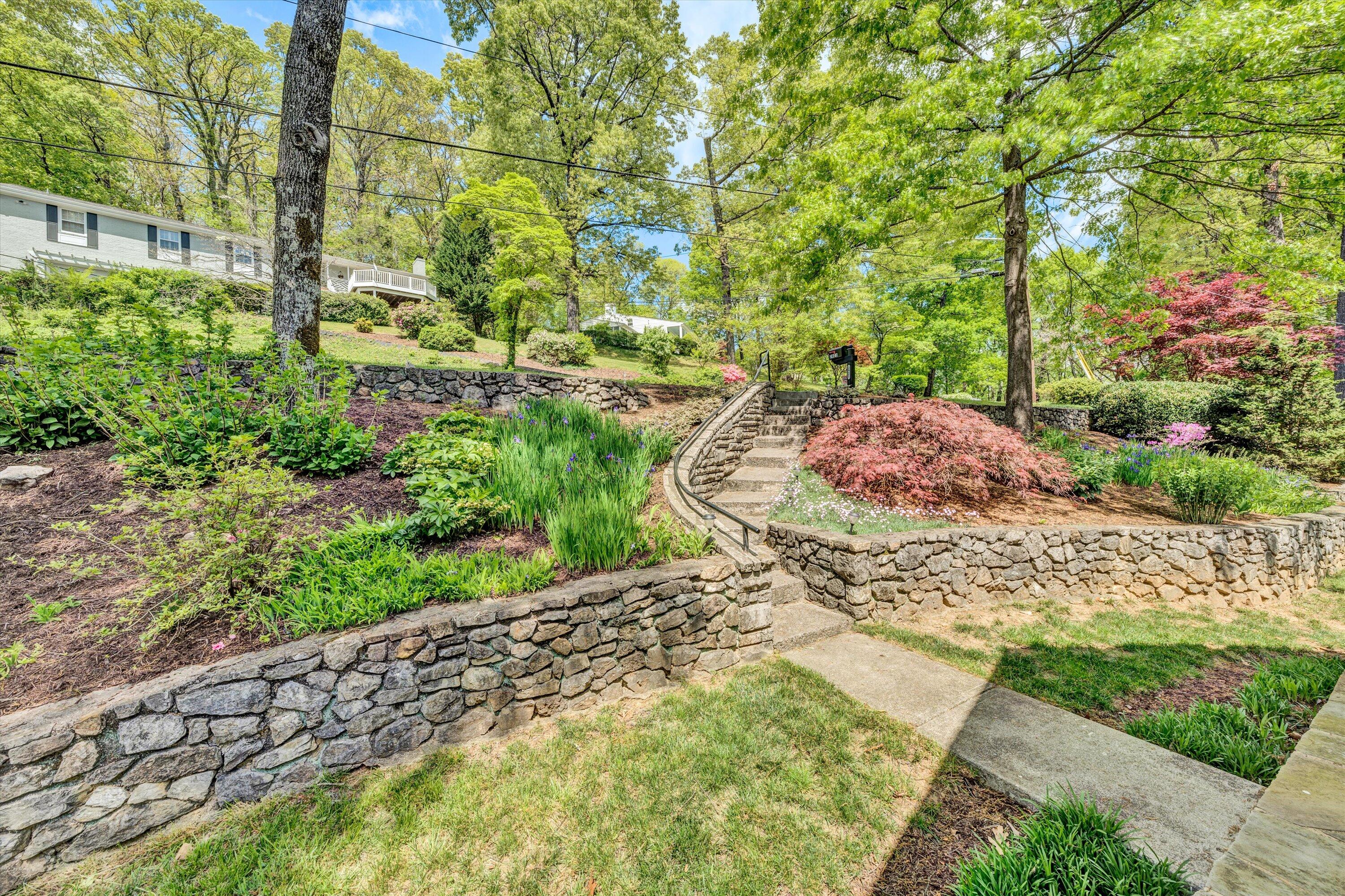 2921 Lockridge Road Southwest Roanoke, VA 24014 - Photo 5 of 53 a view of a garden with plants and large trees