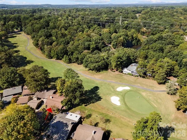 an aerial view of a houses with yard