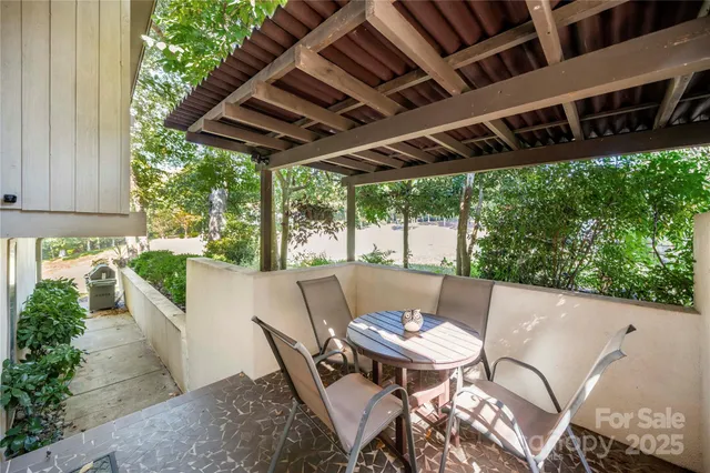 a view of a patio in the backyard
