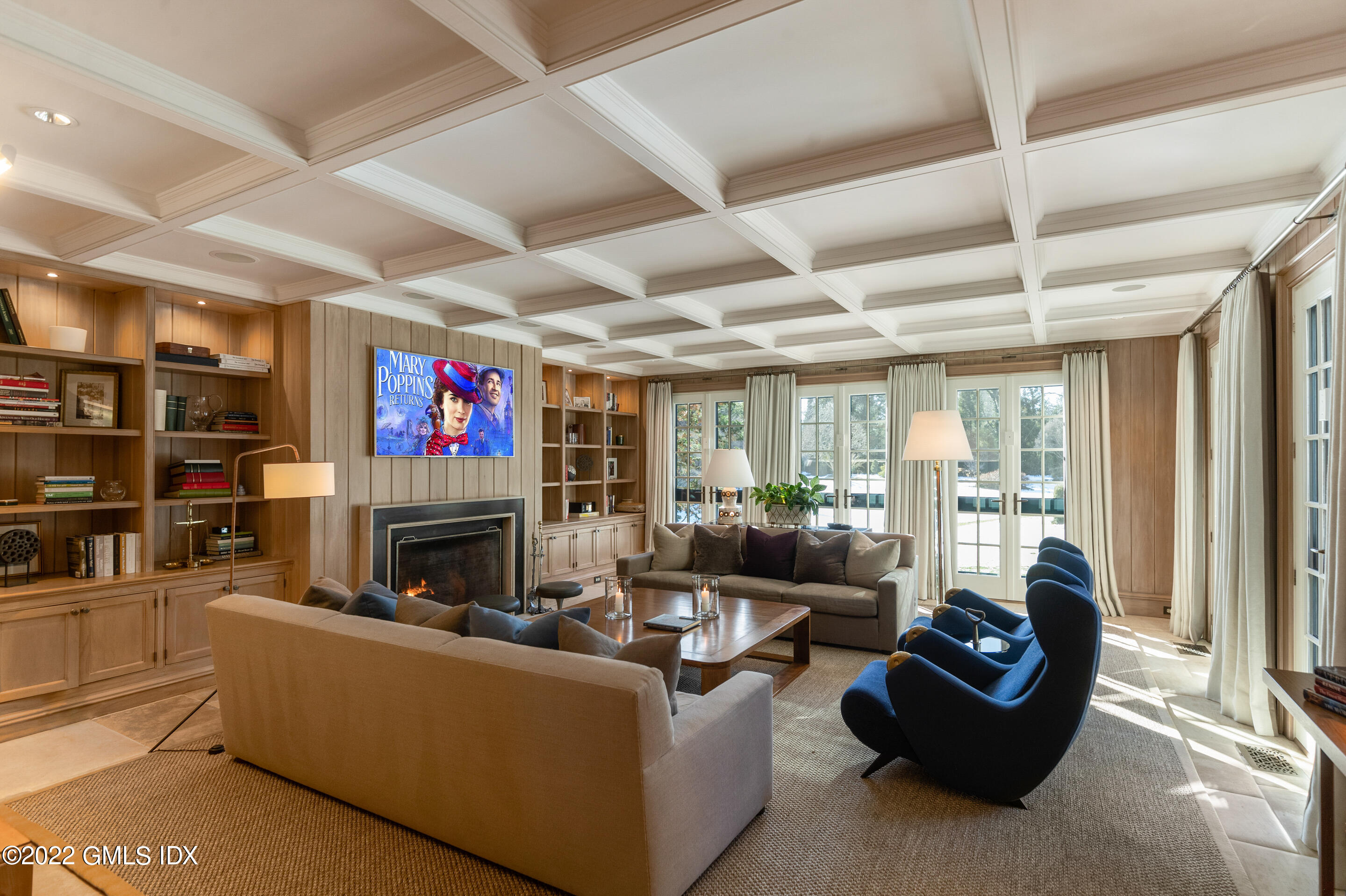 266 Round Hill Road Greenwich, CT 06831 - Photo 15 of 27 a living room with furniture a flat screen tv and a fireplace