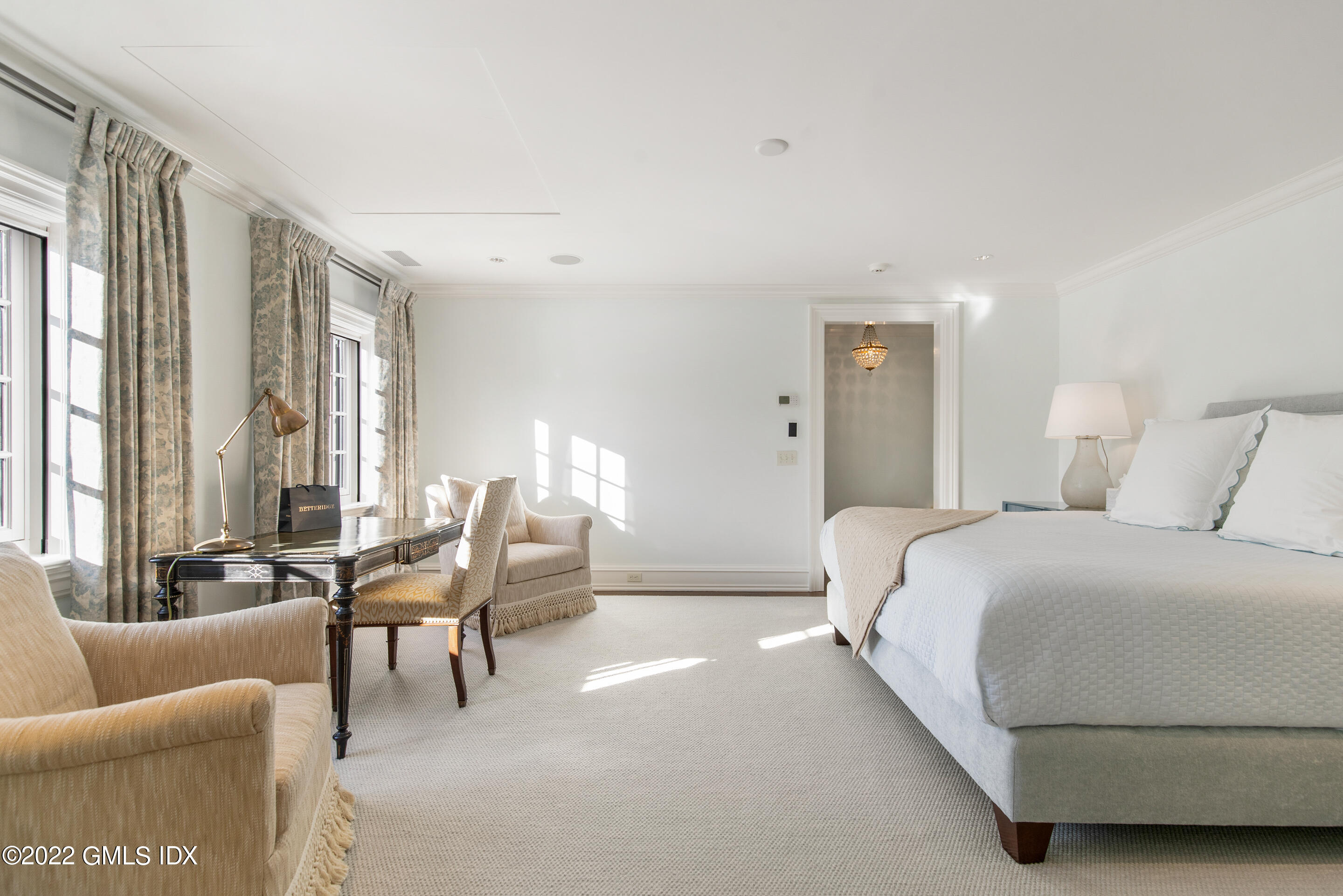 266 Round Hill Road Greenwich, CT 06831 - Photo 18 of 27 a bedroom with furniture and a large window