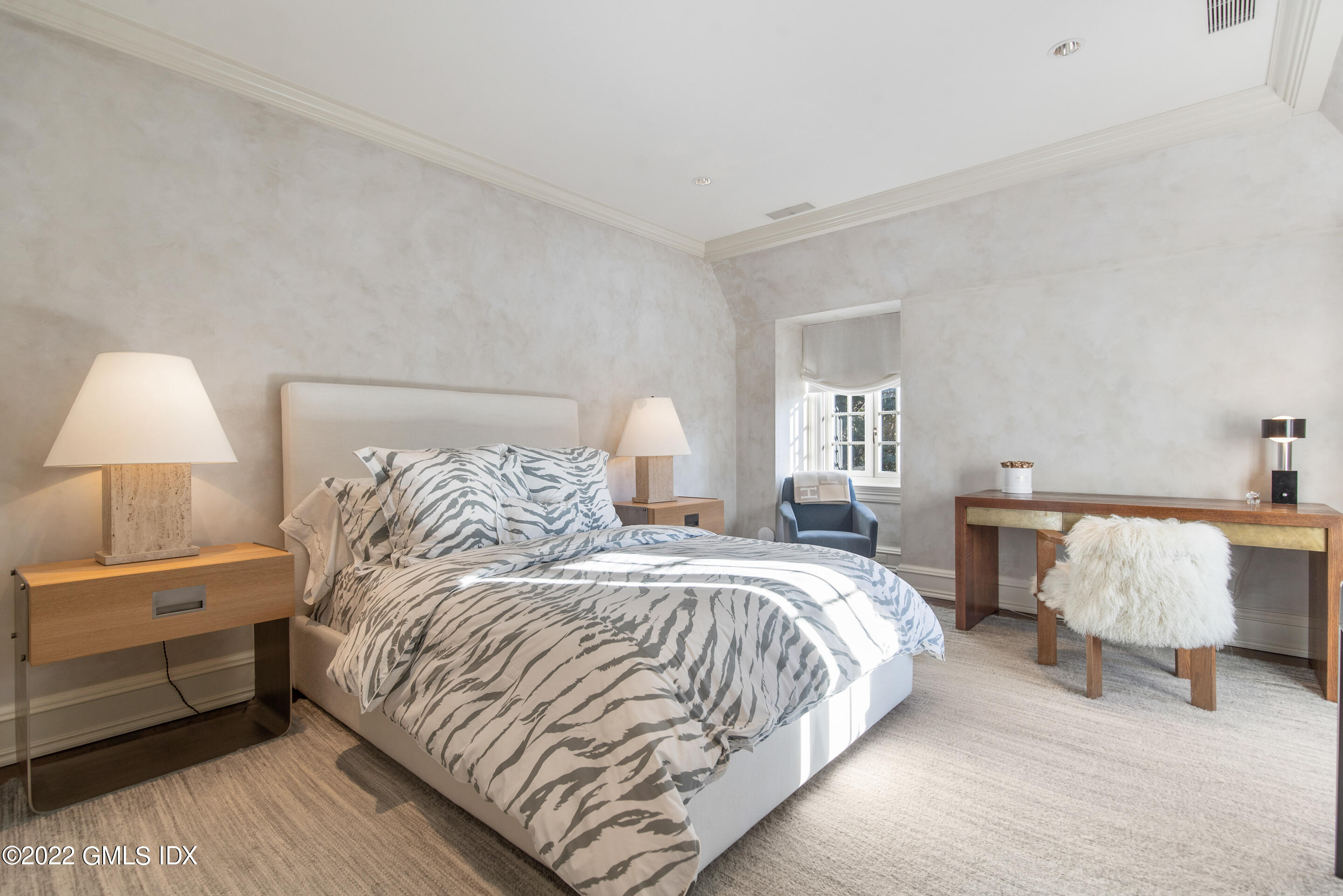 266 Round Hill Road Greenwich, CT 06831 - Photo 22 of 27 a bedroom with a bed and lamp