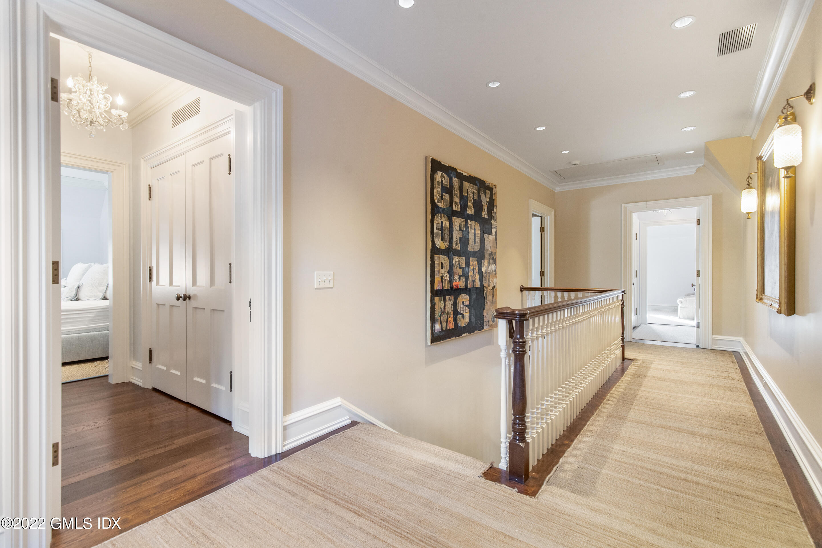 266 Round Hill Road Greenwich, CT 06831 - Photo 24 of 27 a view of a hallway with wooden floor and staircase