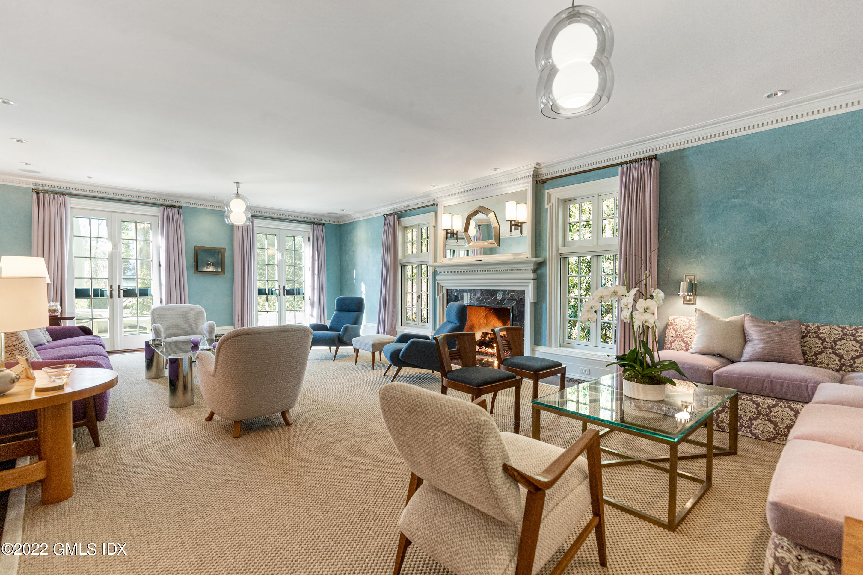 266 Round Hill Road Greenwich, CT 06831 - Photo 3 of 27 a living room with fireplace furniture and a large window