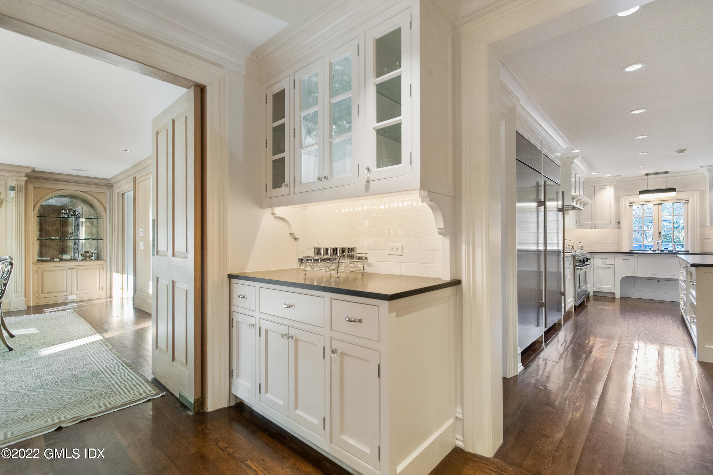 266 Round Hill Road Greenwich, CT 06831 - Photo 8 of 27 a view of a bathroom with entryway and wooden floor