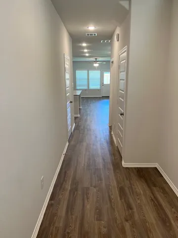 a view of gallery with wooden floor