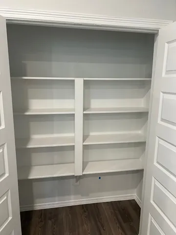 a view of a closet with shelf
