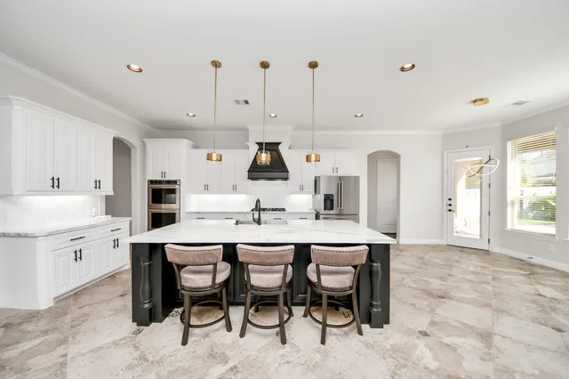 an empty room with wooden floor and fireplace