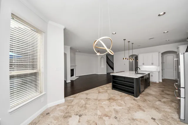 a bedroom with a bed and dresser with mirror