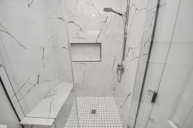 a bathroom with a bathtub and a shower