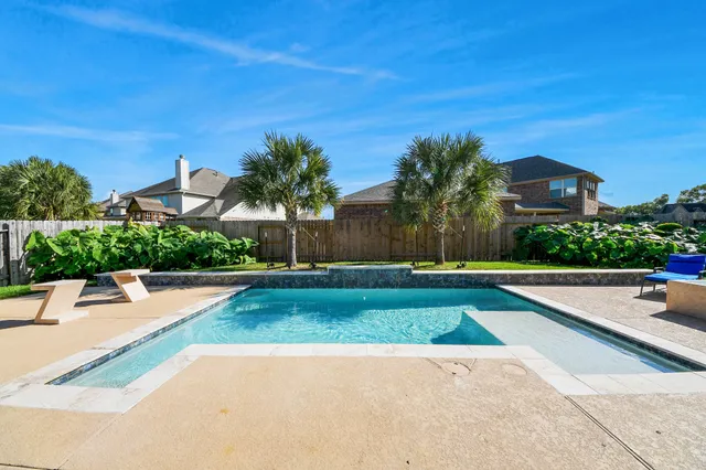 a view of a patio with swimming pool