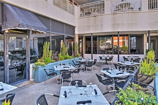 an outdoor space with lots of furniture and garden