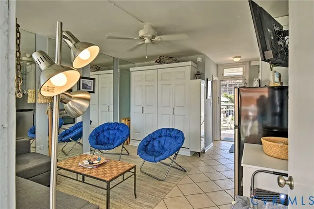 a view of living room kitchen and entryway