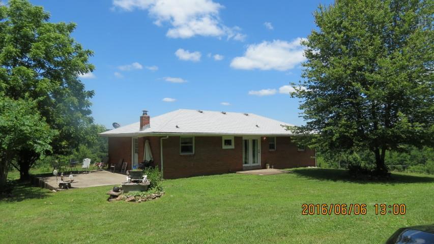 475 Mail Road Erin, TN 37061 - Photo 20 of 21 a view of a house with backyard garden and sitting area